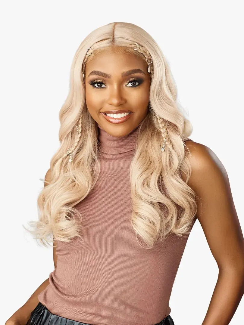 Sensationnel Shear Muse Velisha blonde wig on a smiling model