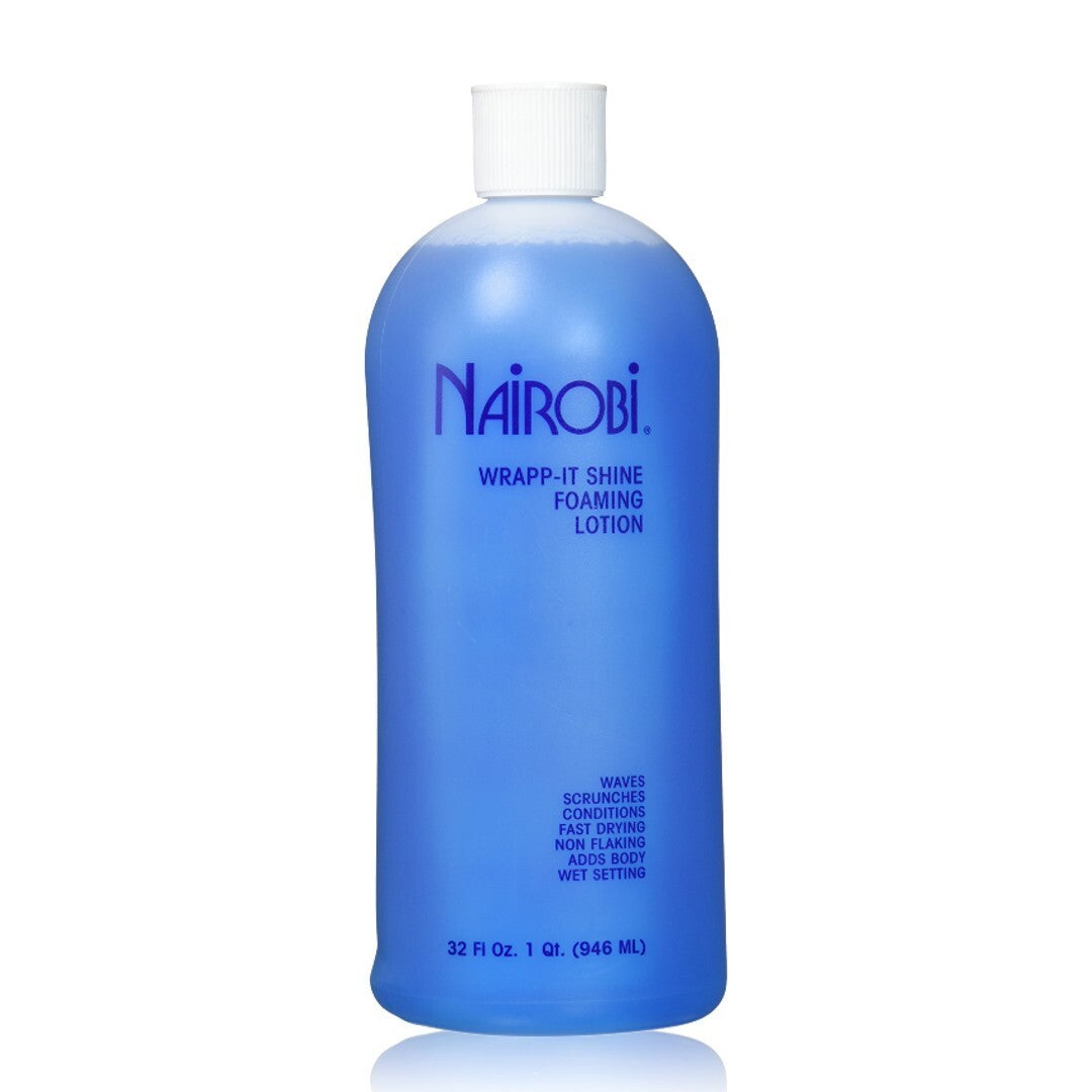 Blue Nairobi wrap-it shine loaming lotion bottle with white cap, 33.8oz label, and wave graphics on a pink background.