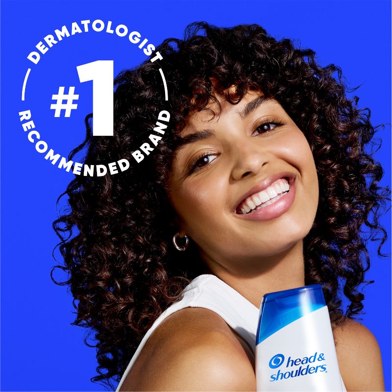 Head & Shoulders Classic Clean 2-in-1 Dandruff Shampoo & Conditioner — model holding Classic Clean bottle