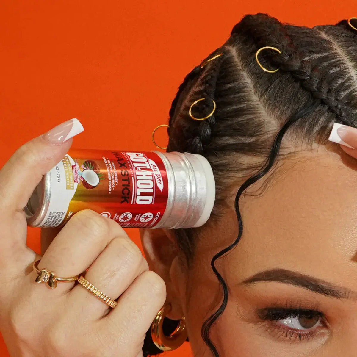 Close-up of GOT2HOLD Hydration wax stick applied along a hairline