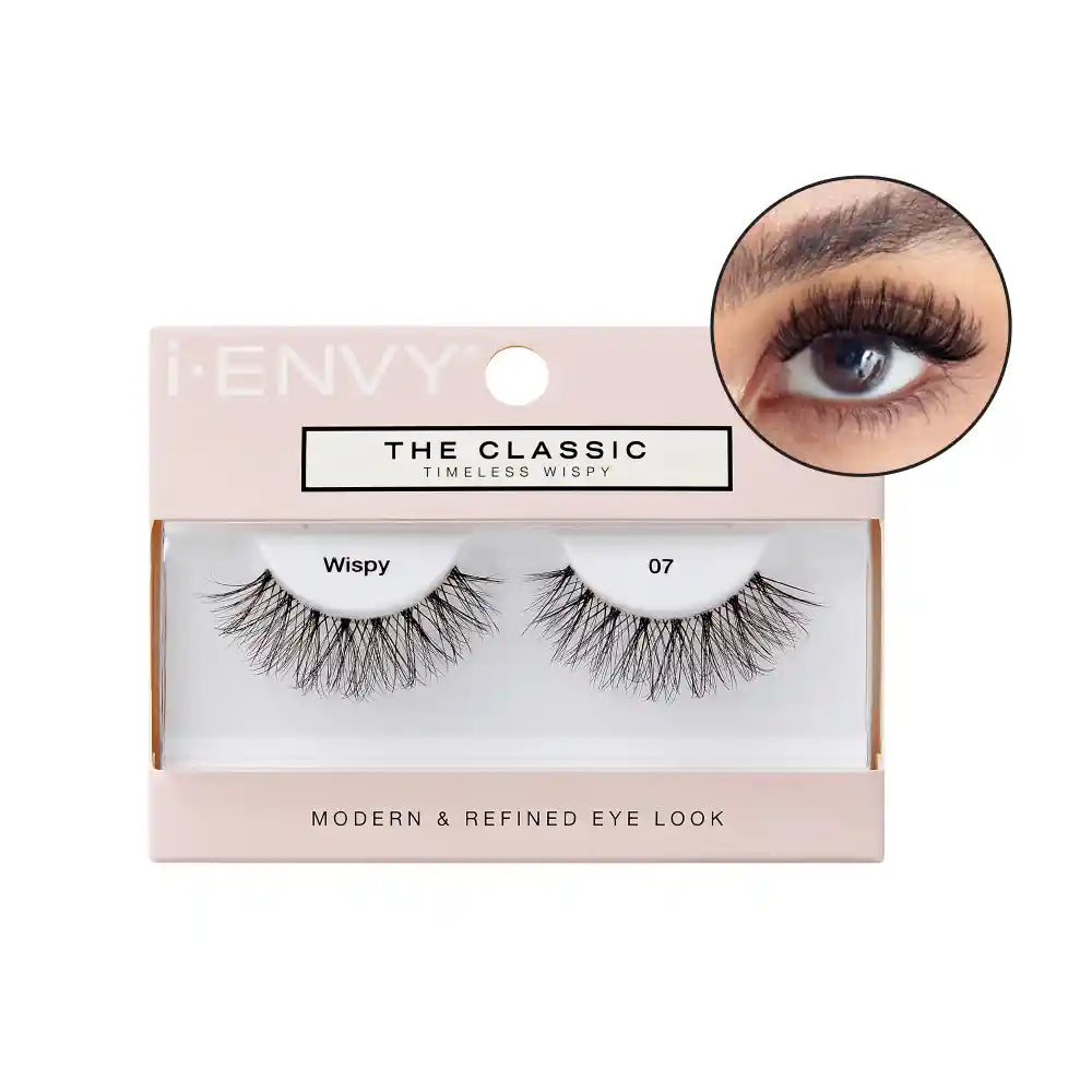 ITC07_main "A single false eyelash. The eyelash is black and features a crisscross pattern at the base, giving it a voluminous and wispy appearance. The individual strands of the eyelash vary in length, creating a natural, fluttery look. The overall shape of the eyelash is curved to fit the natural contour of the eye."