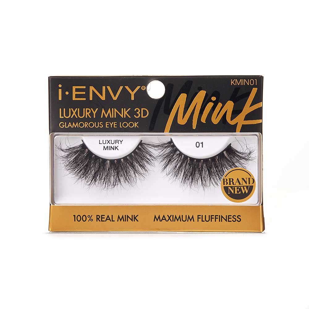 KMIN01_main "A single false eyelash. The eyelash is black and features a dense, voluminous design with varying lengths of individual lashes, creating a natural yet dramatic look. The base of the eyelash strip is slightly curved to fit the natural contour of the eyelid. The lashes are finely tapered at the ends, giving them a wispy and fluttery appearance."