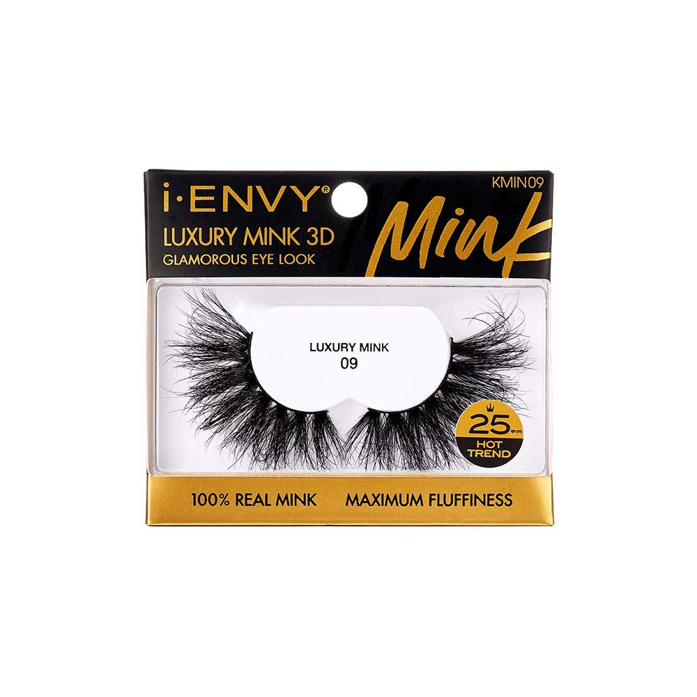 KMIN09_main "A single false eyelash. The eyelash is black and features a dense, wispy design with varying lengths of individual lashes, creating a voluminous and dramatic effect. The base of the eyelash is a thin, flexible strip that is used to attach the eyelash to the eyelid. The lashes are arranged in a slightly curved shape to mimic the natural curve of the eye."