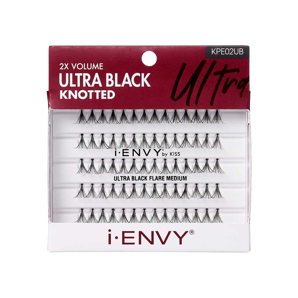 KPE02UB_main "A product package for i-ENVY by KISS. The packaging is primarily white with a red top section. The top section has the text "2X VOLUME ULTRA BLACK KNOTTED" in white, and "ULTRA" in a stylized black font. The product code "KPE02UB" is also visible in the top right corner. The middle section of the packaging has a clear window displaying several rows of individual false eyelash clusters."