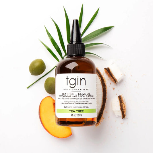 TGIN Tea Tree + Olive Oil Detoxifying Hair & Scalp Serum 4 oz — serum bottle with plant props