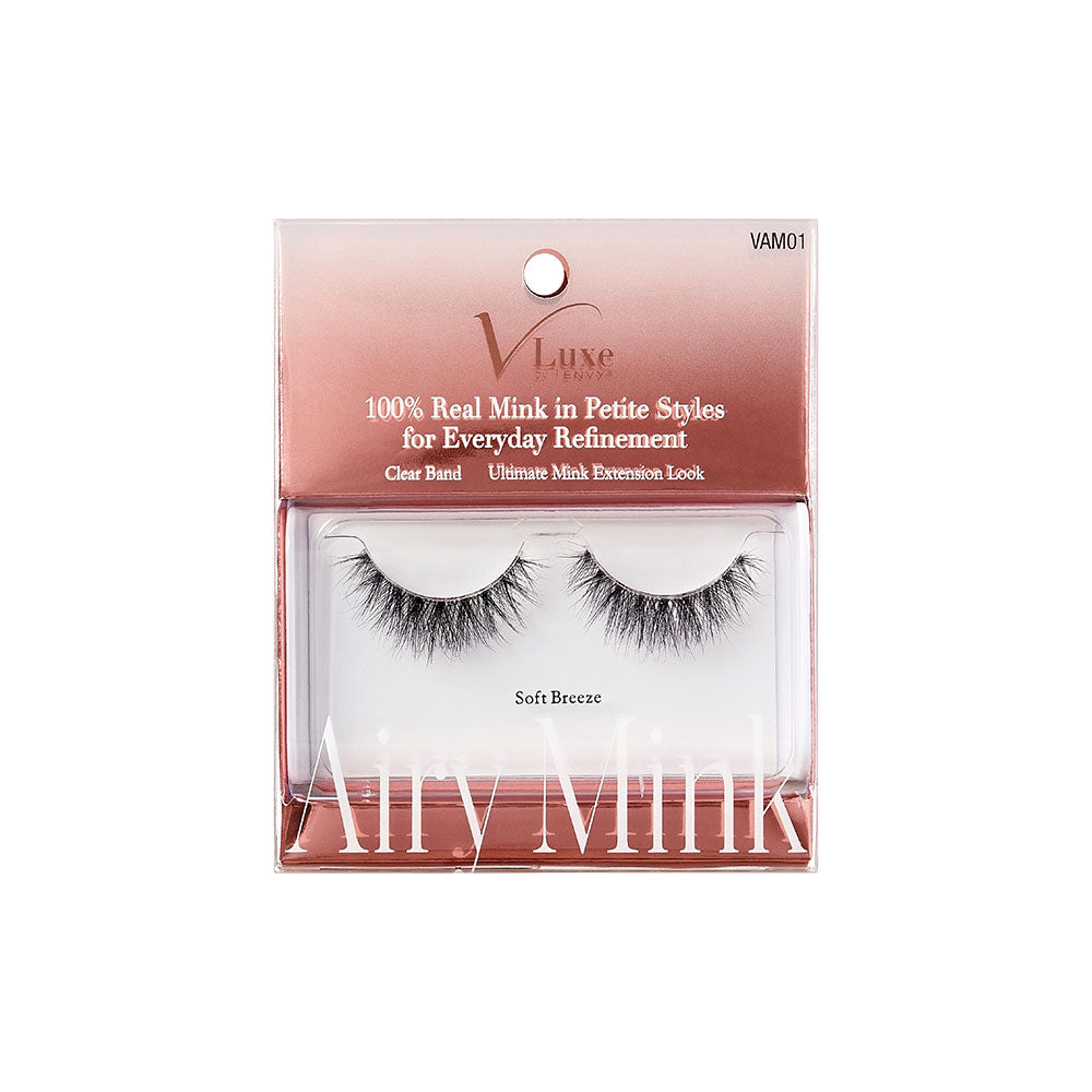 VAM01_main "A single strip of false eyelashes. The eyelashes are black and appear to be voluminous with a wispy, fluttery design. The lashes are arranged in a curved shape, mimicking the natural curve of the eyelid. The individual lashes vary in length, with some being longer and more prominent, creating a dramatic and full look. The base of the strip is thin and flexible, designed to adhere to the eyelid for easy application."