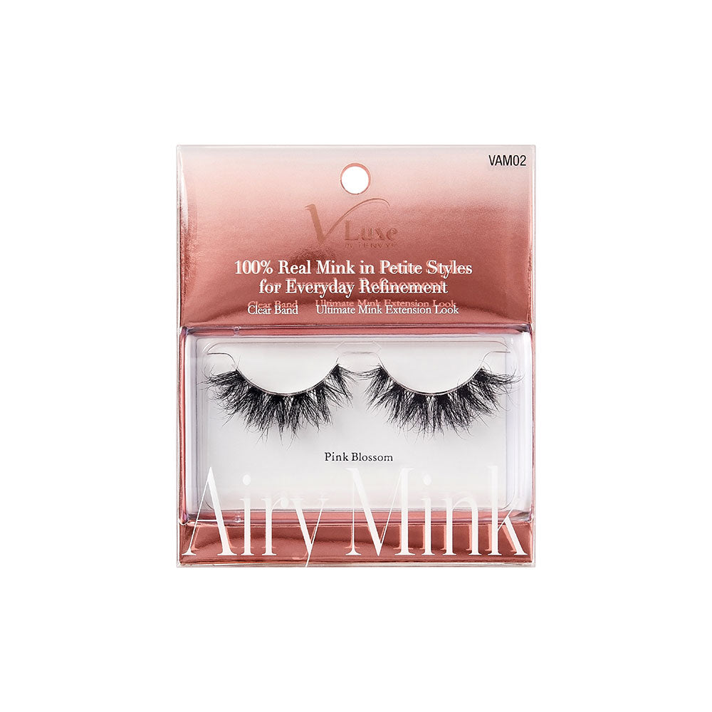 VAM02_main "A single false eyelash. The eyelash is black and features a dramatic, voluminous design with long, wispy strands. The lashes are densely packed at the base and gradually become more sparse and feathery towards the tips, creating a fluttery and full appearance. The curvature of the eyelash suggests it is designed to fit along the natural lash line. The background is plain white, highlighting the details of the eyelash."