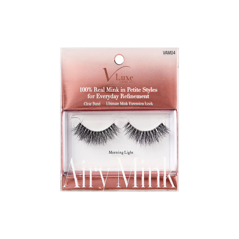 VAM04_main "A single false eyelash. The eyelash is black and features a dense, wispy design with varying lengths of individual lashes, creating a voluminous and dramatic effect. The base of the eyelash is slightly curved to fit the natural contour of the eyelid. The lashes appear to be made of synthetic fibers, designed to enhance the fullness and length of natural eyelashes when applied."