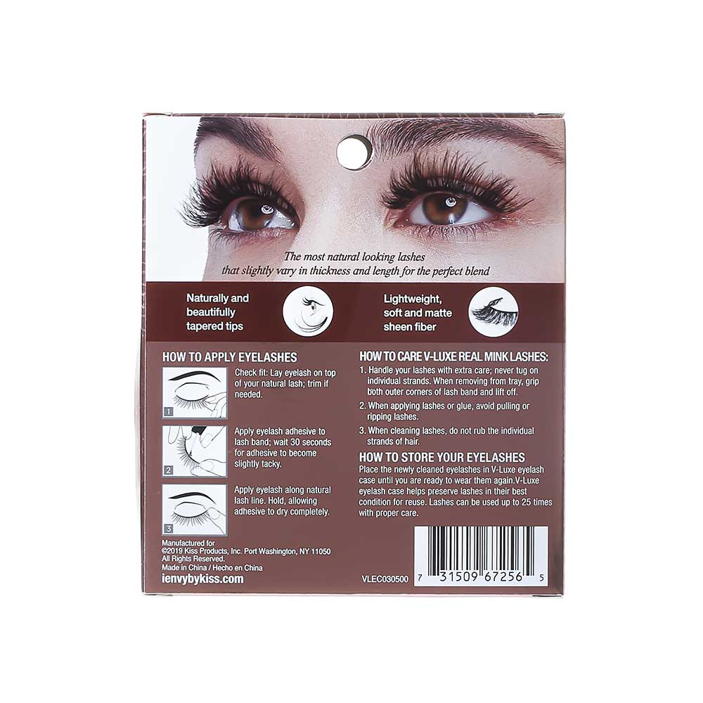 VLEC03_extra_005 "A package of false eyelashes. The packaging is transparent, allowing the eyelashes to be clearly visible. The eyelashes are thick and voluminous, with a slightly curled design. The brand name "V Luxe by i-Envy" is printed on the packaging, along with the style name "Velvet Rose." The background inside the packaging has a subtle, glittery texture."