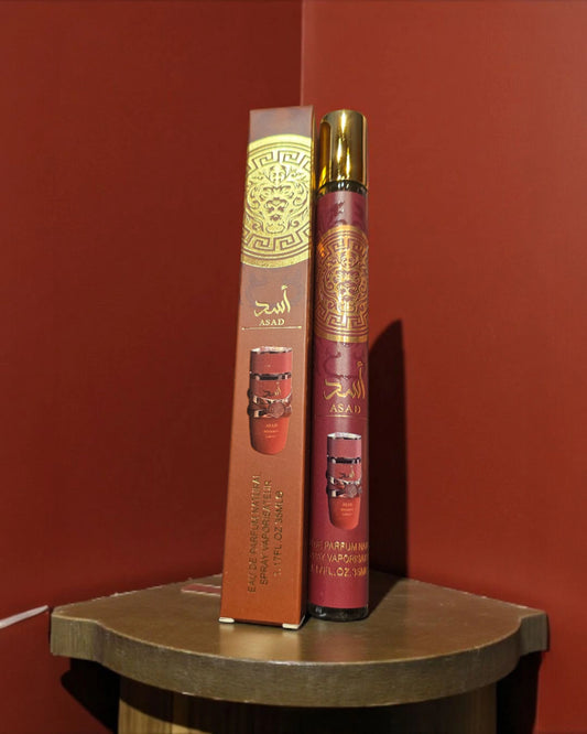Asad Bourbon inspired 35 ml eau de parfum travel spray in brown-and-gold decorated bottle and box