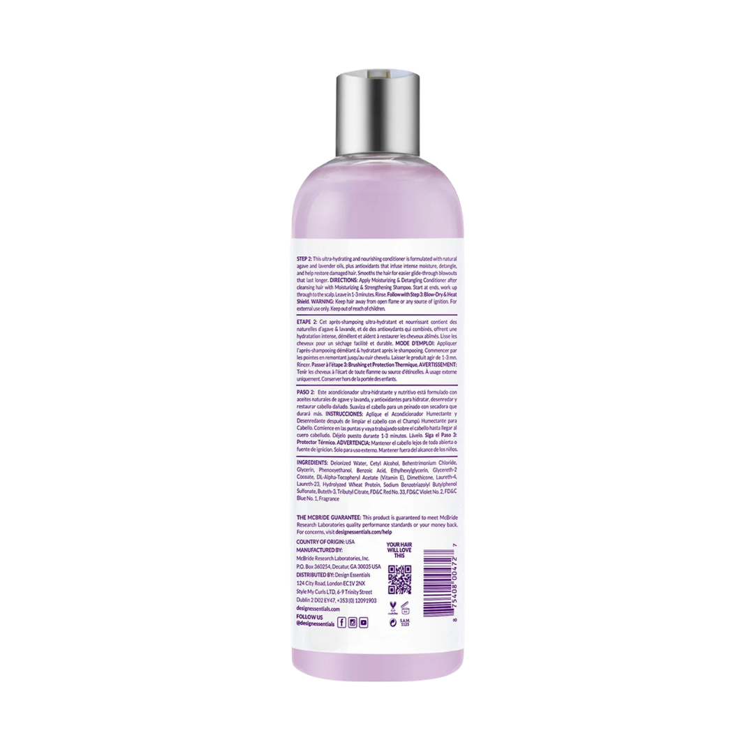 A bottle of hair developer shown from the back, featuring a translucent light purple body, a metallic silver cap, and a white label with purple text.