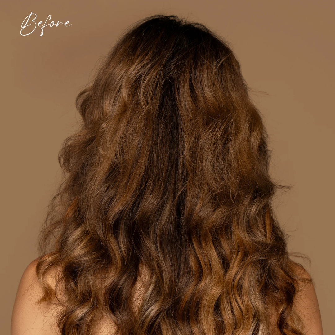 Long, wavy brown hair on a plain background