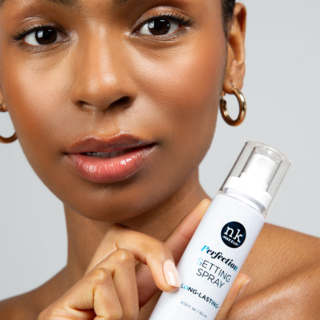 Nicka K Perfection Setting Spray, model holding Long Lasting spray